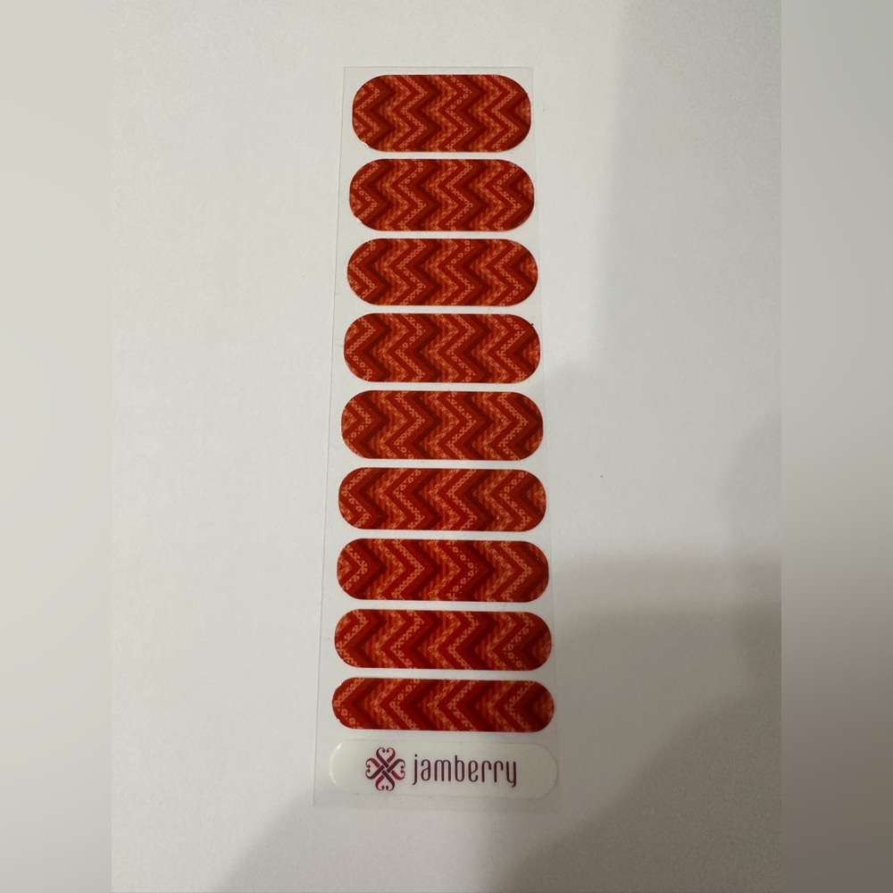 Jamberry Nail Wraps: red, orange, burgundy.